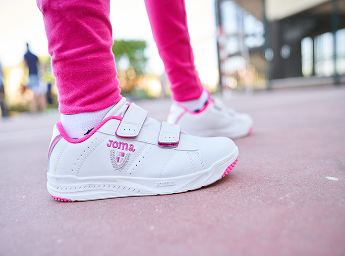 Children's feet wearing school shoes Play Joma