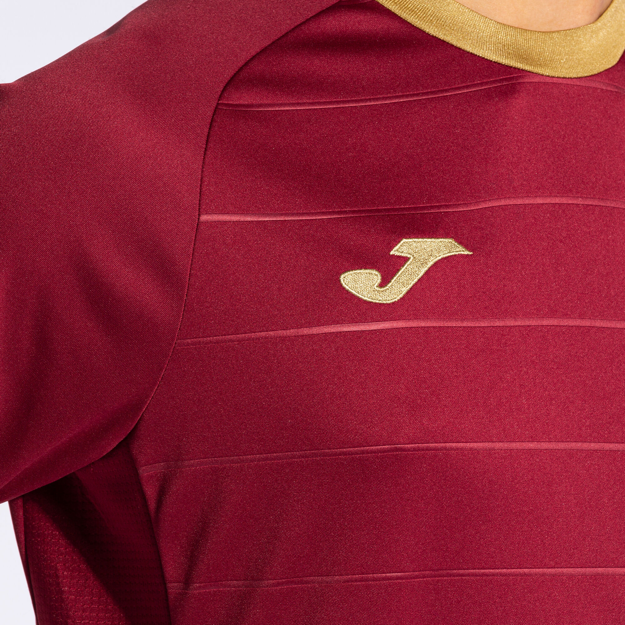 Burgundy and gold puma shirt deals