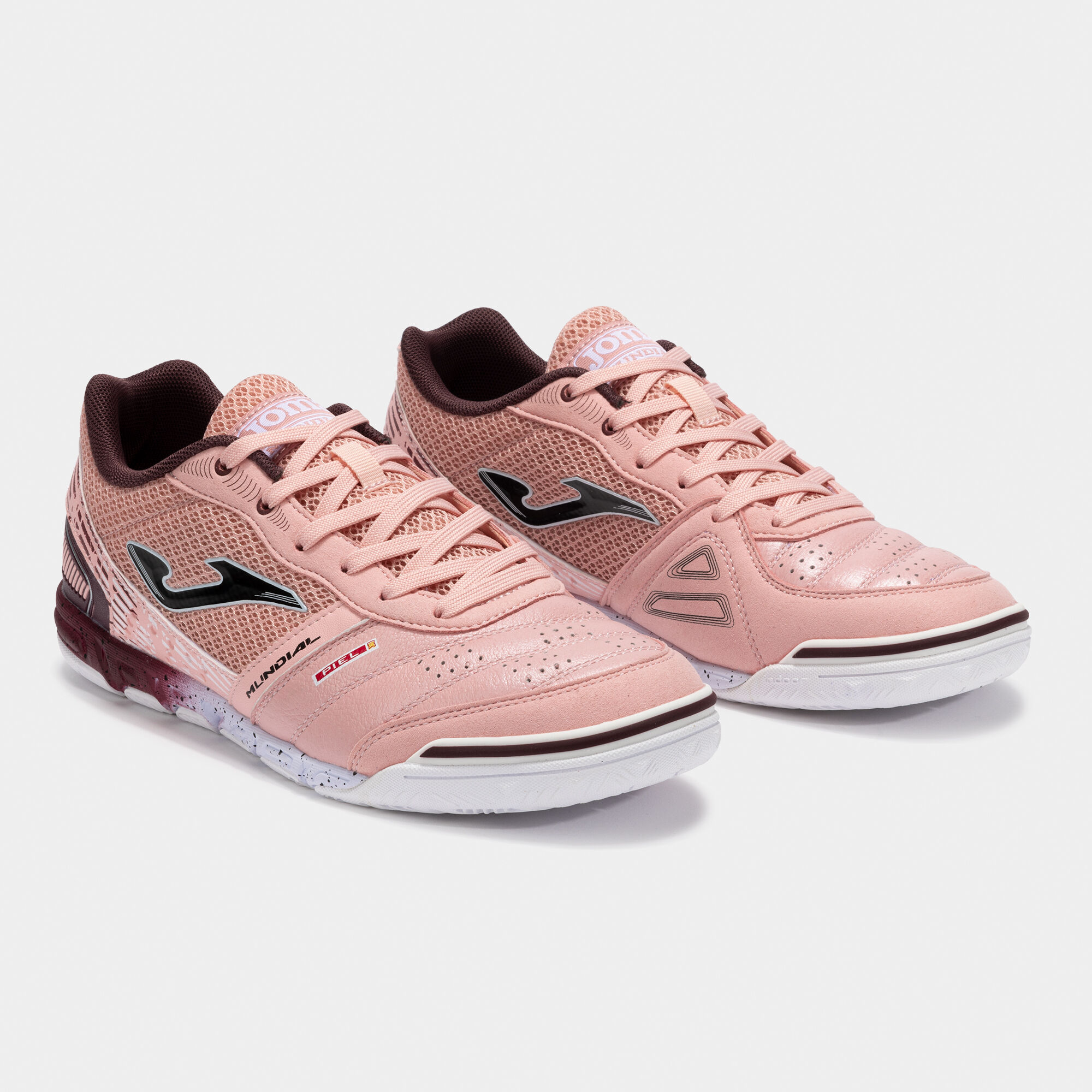 pink and white indoor soccer shoes