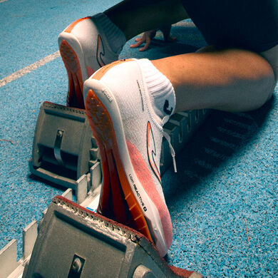 Zapatillas running R.R 1100 Skypes unisex blanco naranja