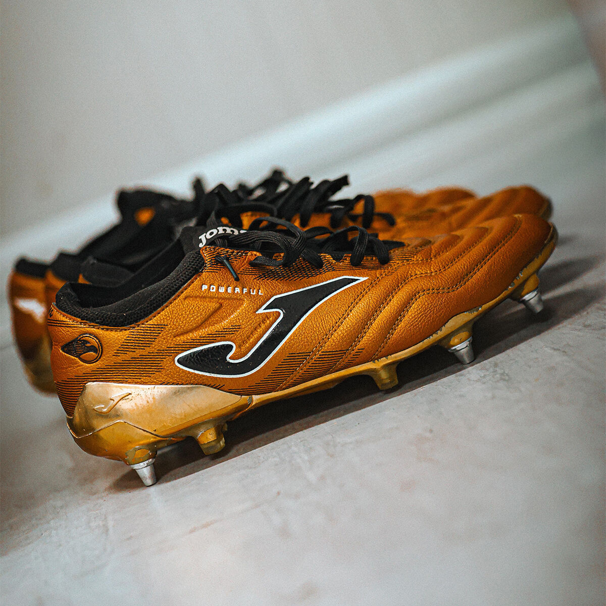 Football boots Powerful Cup 24 soft ground gold black | JOMA®